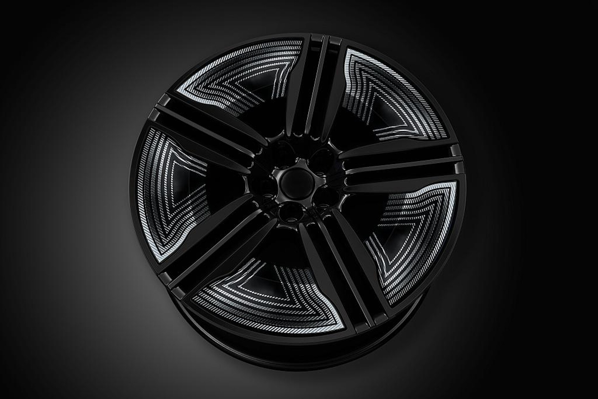 Mit Heißprägen Performance+ lassen sich selbst stark verformte Bauteile wie Felgeneinleger präzise veredeln. (Foto: Kurz)