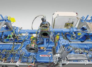 Troester: Automatisch zentrierende Spritzköpfe